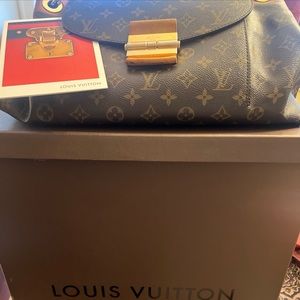 Authentic Louis Vuitton Olympe Bag with box and dust bag.